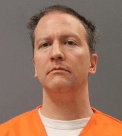 A man in an orange prison uniform with a neutral expression.