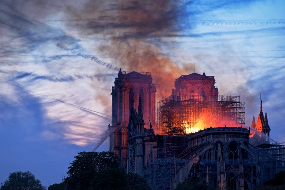 Notre-Dame Cathedral engulfed in flames during a historic fire.