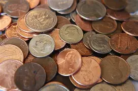 Close-up of various US coins in a pile.